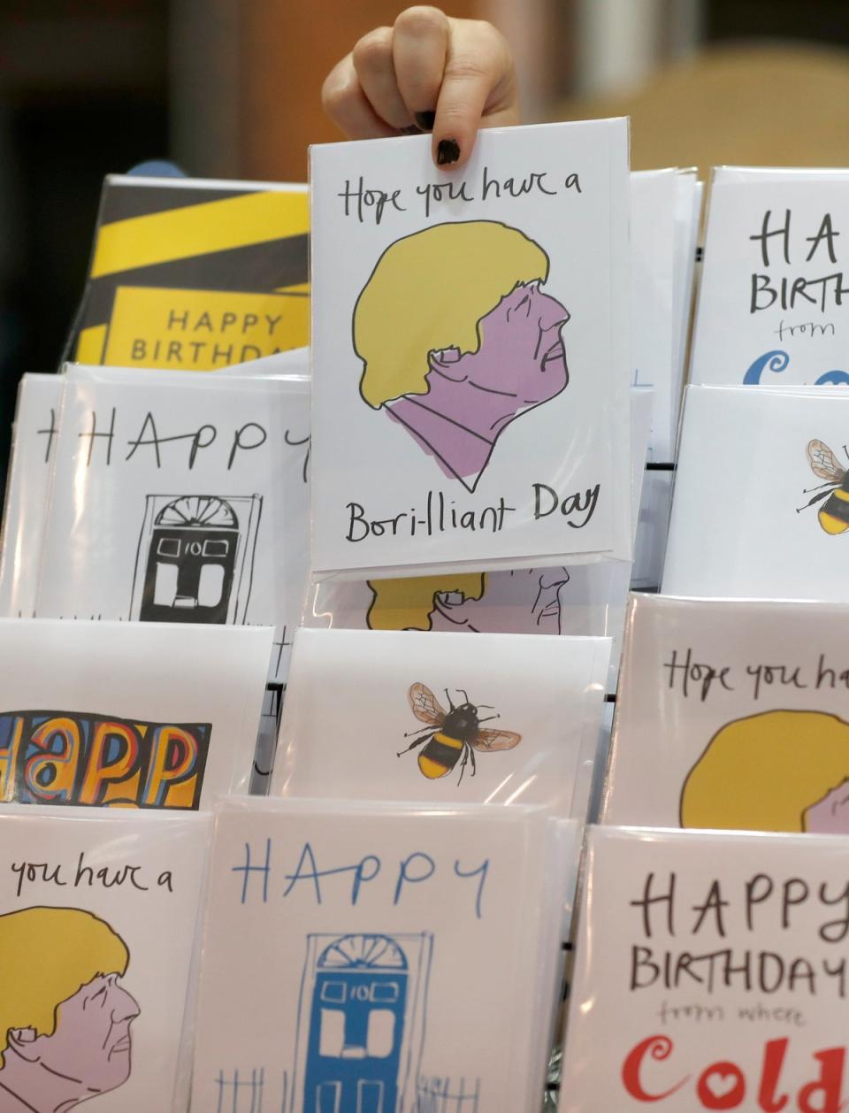 Boris Johnson and other Conservative themed cards for sale at the Conservative Party Conference in Manchester on 29 September (AP)