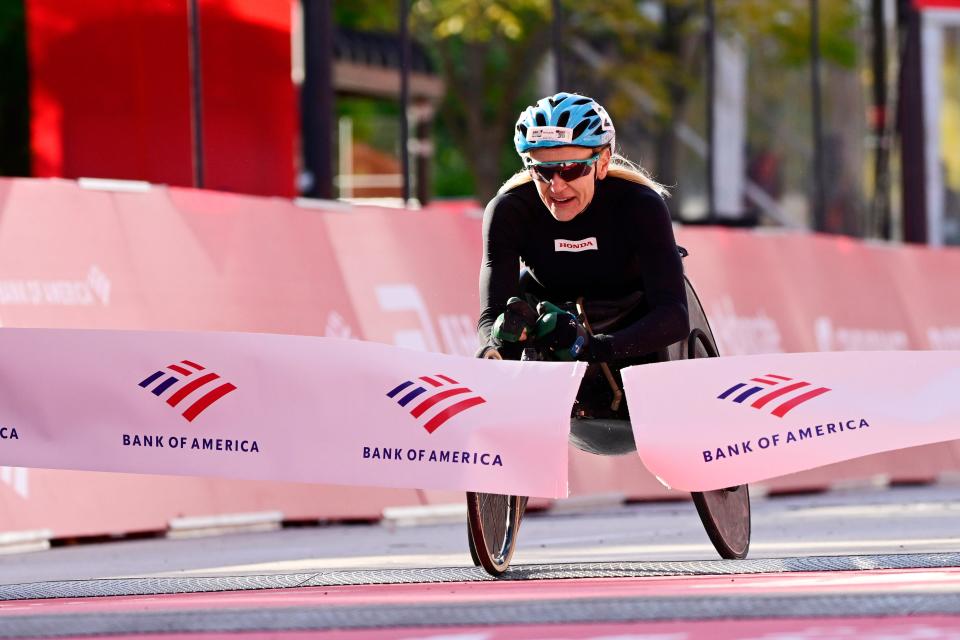 Susannah Scaroni crosses the finish line to win the 2022 Chicago Marathon female wheelchair division in Chicago on Oct. 9, 2022.