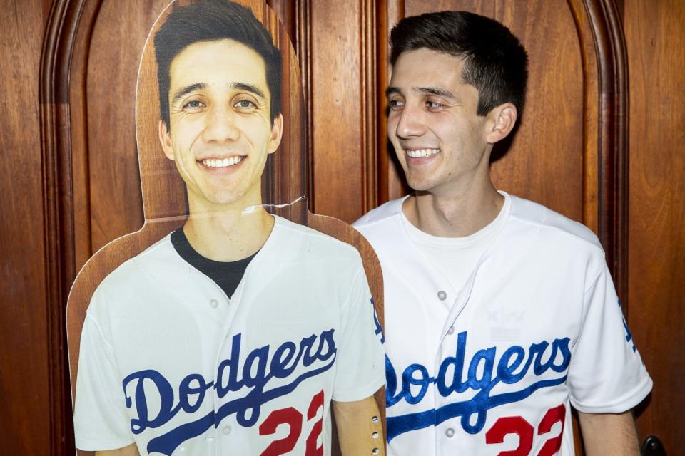 Austin Donley sits alongside his life-size image.