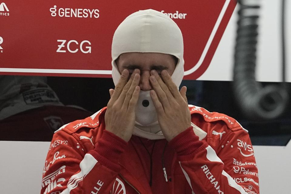 Ferrari driver Charles Leclerc, of Monaco, rubs his eyes before the start of the second practice session for the Formula One Las Vegas Grand Prix auto race, Friday, Nov. 17, 2023, in Las Vegas. (AP Photo/Darron Cummings)
