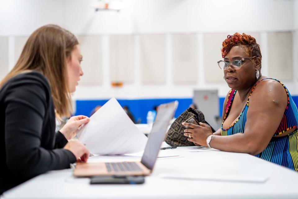 Kelisha Williams, right, 47, of Detroit, talks with Detroit Mercy School of Law third-year student Savanna Polimeni while working to get the proper paperwork needed for her divorce during the William Booth Legal Aid Clinic at the Salvation Army Detroit Harbor Light on Thursday, June 1, 2023. The clinic is the Salvation Army's only free legal service provider in the world, serving low-income residents in metro Detroit. In Detroit, three attorneys take on more than 1,500 cases a year and are constantly inundated with calls for help.