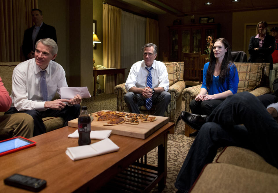 Republican presidential candidate, former Massachusetts Gov. Mitt Romney, center, watches the vice presidential debate in his hotel room on Thursday, Oct. 11, 2012, in Asheville, N.C. (AP Photo/ Evan Vucci)