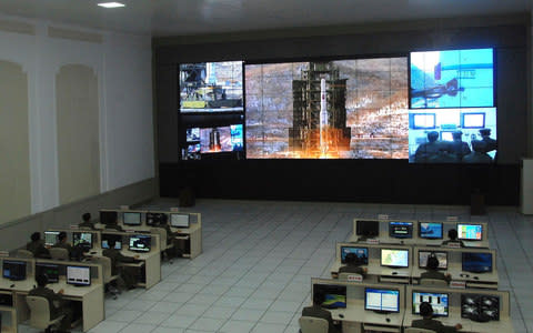 North Korean scientists at work in 2012 during launch of the Unha-3 rocket - Credit: KCNA via Reuters