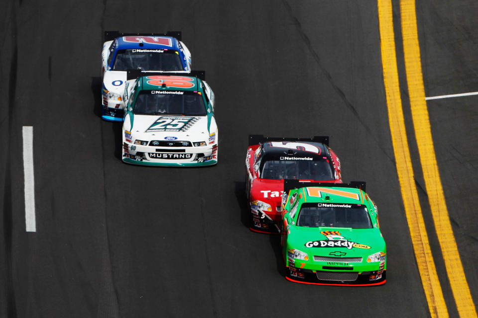 DAYTONA BEACH, FL - FEBRUARY 25: Danica Patrick, driver of the #7 GoDaddy.com Chevrolet, is pushed by teammate Dale Earnhardt Jr., driver of the #5 TaxSlayer.com Chevrolet, as Trevor Bayne, driver of the #60 Roush Fenway Racing Ford, is pushed by Elliott Sadler, driver of the #2 OneMain Financial Chevrolet, during the NASCAR Nationwide Series DRIVE4COPD 300 at Daytona International Speedway on February 25, 2012 in Daytona Beach, Florida. (Photo by Tom Pennington/Getty Images for NASCAR)