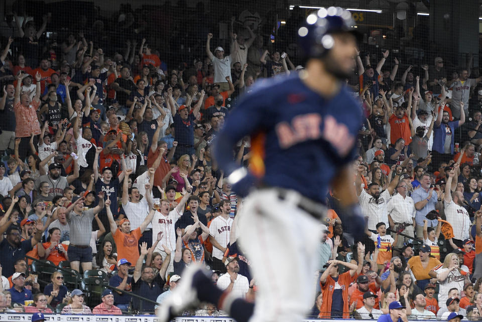 Fans cheer as Houston Astros' Abraham Toro rounds the bases after hitting a two-run home run during the fifth inning of a baseball game against the Texas Rangers, Sunday, July 25, 2021, in Houston. (AP Photo/Eric Christian Smith)