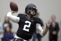 Texas A&M quarterback Johnny Manziel passes the ball during a drill at pro day for NFL football representatives in College Station, Texas, Thursday, March 27, 2014. (AP Photo/Patric Schneider)