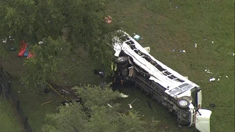 Emergency personnel work the scene of a deadly crash on Tuesday, May 14, 2024 in Marion County, Fla. The Florida Highway Patrol says a bus carrying farmworkers in central Florida has overturned, killing several people and injuring other passengers. Authorities say the bus was transporting farmworkers on Tuesday morning when it collided with a truck and swerved off a road in Marion County, north of Orlando. (WFTS via AP)