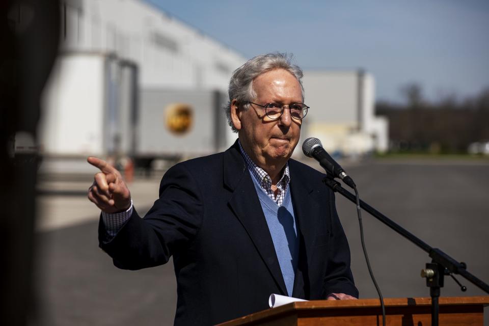 Senate Minority Leader Mitch McConnell gestures while speaking to the media after he toured the McKesson distribution center in Shepherdsville, Ky. Tuesday, March 30, 2021