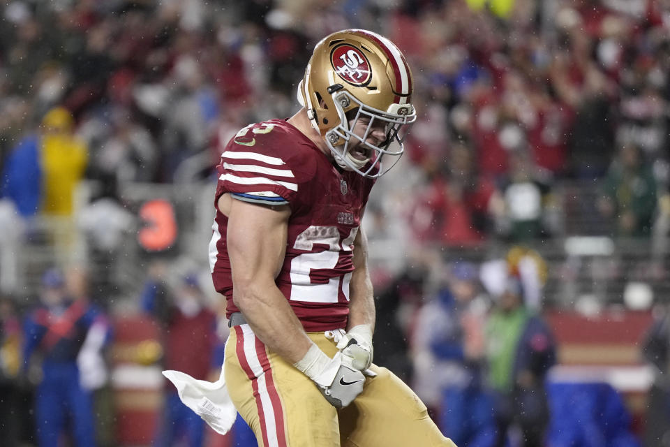 SANTA CLARA, CALIFORNIA – JANUARY 20: Christian McCaffrey #23 of the San Francisco 49ers celebrates after scoring a 6-yard rushing touchdown during the fourth quarter against the <a class="link " href="https://sports.yahoo.com/nfl/teams/green-bay/" data-i13n="sec:content-canvas;subsec:anchor_text;elm:context_link" data-ylk="slk:Green Bay Packers;sec:content-canvas;subsec:anchor_text;elm:context_link;itc:0">Green Bay Packers</a> in the NFC Divisional Playoffs at Levi’s Stadium on January 20, 2024 in Santa Clara, California. (Photo by Thearon W. Henderson/Getty Images)