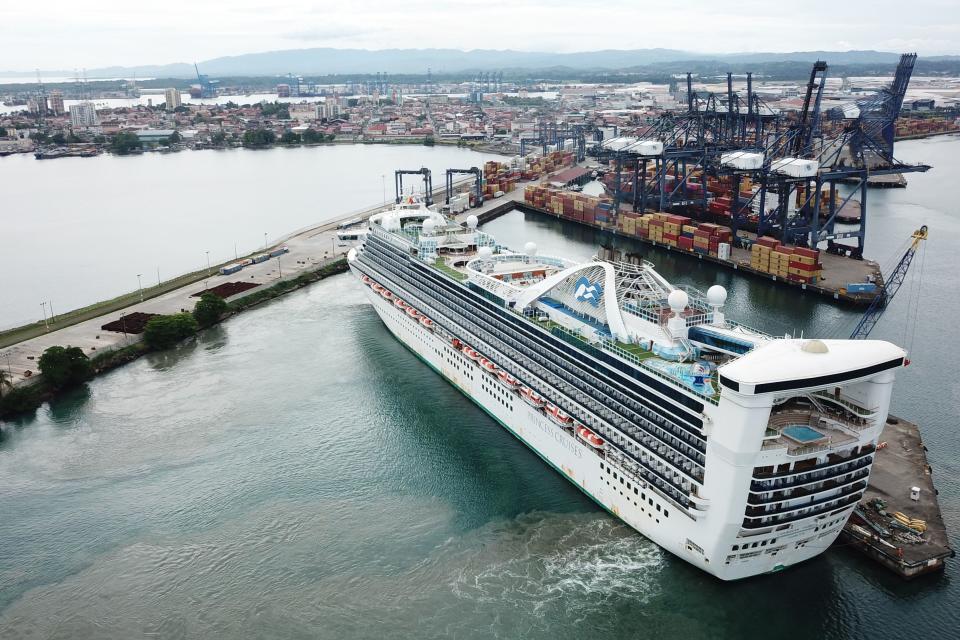Aerial view of the "Caribbean Princess" cruise docked at the port of Colon, in Panama, on May 28, 2020. - About 25 Panamanians crew members from different cruise ships that were stranded all over the world due to the covid-19 pandemic, arrived on Thursday on the "Caribbean Princess" cruise after been at sea for more than 60 days in some cases. (Photo by Ivan PISARENKO / AFP) (Photo by IVAN PISARENKO/AFP via Getty Images)
