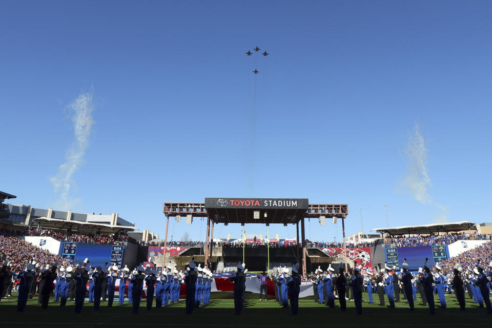 F-16s with the 114th Fighter Wing, South Dakota Air National Guard, fly over the stadium during the national anthem before the FCS Championship NCAA college football game between South Dakota State and Montana, Sunday, Jan. 7, 2024, in Frisco, Texas. (AP Photo/Richard W. Rodriguez)