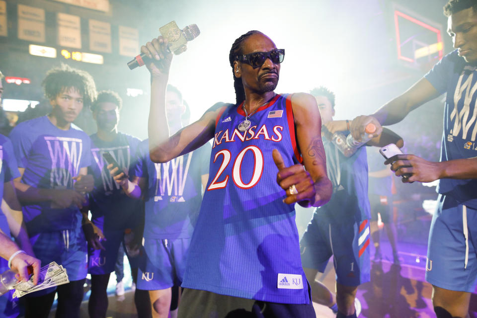 In this Friday, Oct. 4, 2019 photo, rapper Snoop Dogg performs for the Allen Fieldhouse crowd during Late Night in the Phog, Kansas' annual NCAA college basketball kickoff at Allen Fieldhouse in Lawrence, Kan. (Nick Krug/The Lawrence Journal-World via AP)