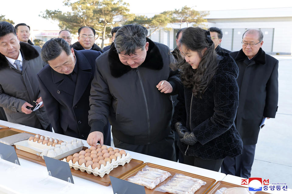 In this photo provided on Monday, Jan. 8, 2024, by the North Korean government, North Korean leader Kim Jong Un, center, with his daughter visits a newly-built chicken farm in Hwangju County of North Hwanghae Province on Jan. 7, 2024. Independent journalists were not given access to cover the event depicted in this image distributed by the North Korean government. The content of this image is as provided and cannot be independently verified. Korean language watermark on image as provided by source reads: "KCNA" which is the abbreviation for Korean Central News Agency. (Korean Central News Agency/Korea News Service via AP)