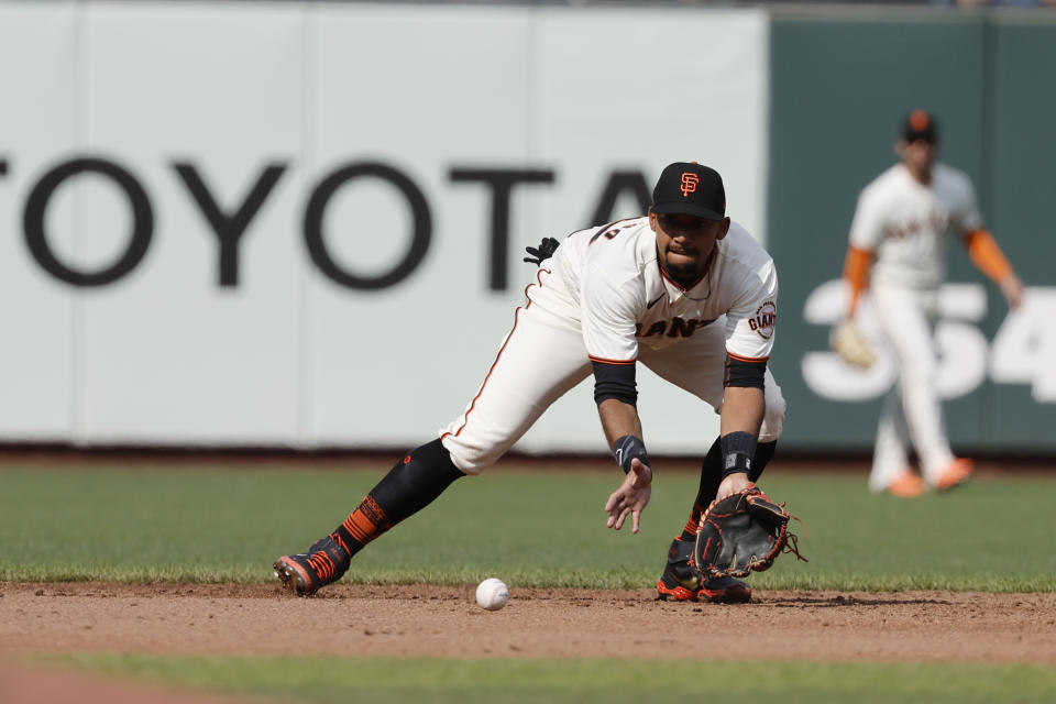 San Francisco Giants' Dixon Machado fields the ball during the third inning of a baseball game against the Chicago Cubs in San Francisco, Sunday, July 31, 2022. (AP Photo/Josie Lepe)