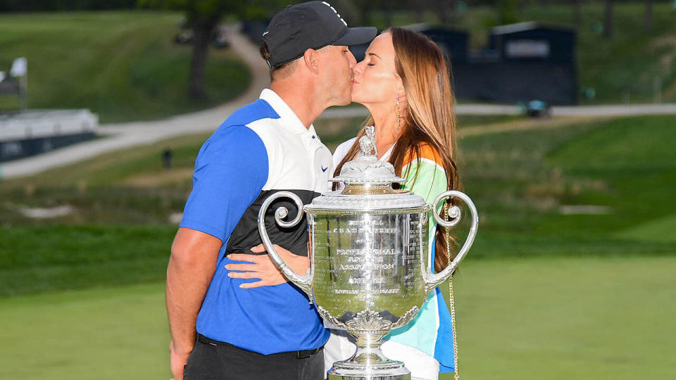 Brooks Koepka poses with girlfriend Jena Sims. (Photo by Ross Kinnaird/Getty Images)