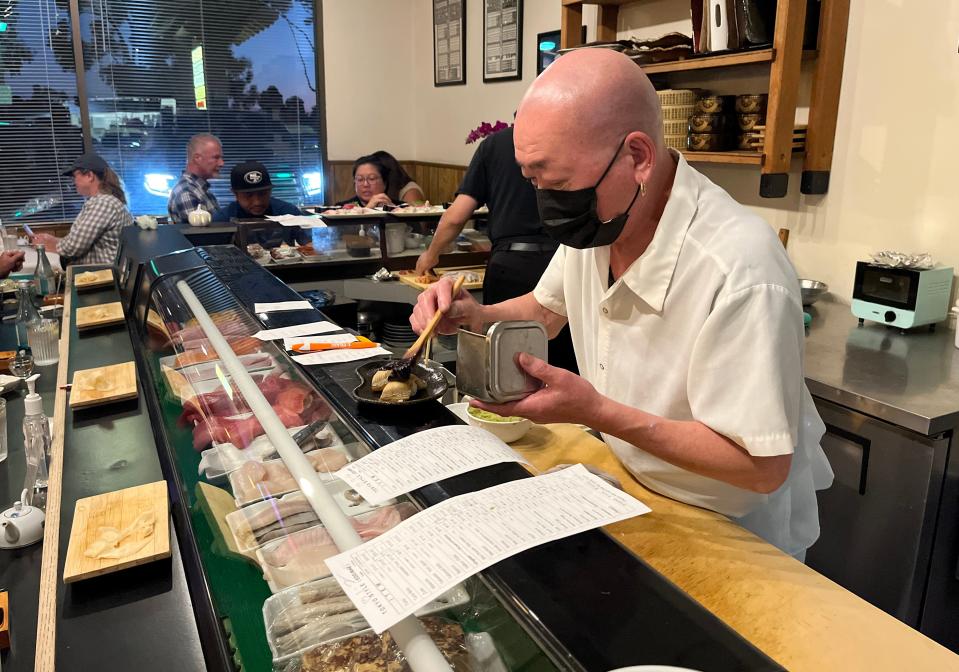 Tadashi Arakawa prepares a plate of sushi at Sushi Hanada on Wednesday, Nov. 1, 2023.