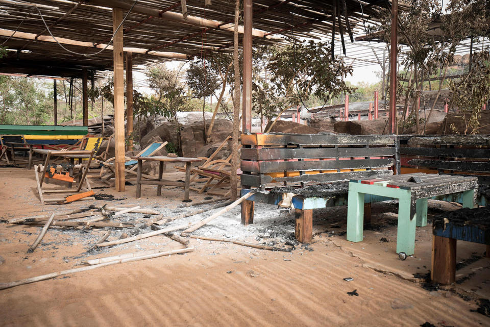 <p>A picture taken on June 19, 2017 in Kangaba tourist resort near Bamako shows the smoldering remains after suspected jihadists stormed the resort on June 18, briefly seizing more than 30 hostages and leaving at least two people dead. (Michele Cattani/AFP/Getty Images) </p>