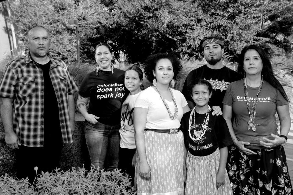 A group of people pose outside