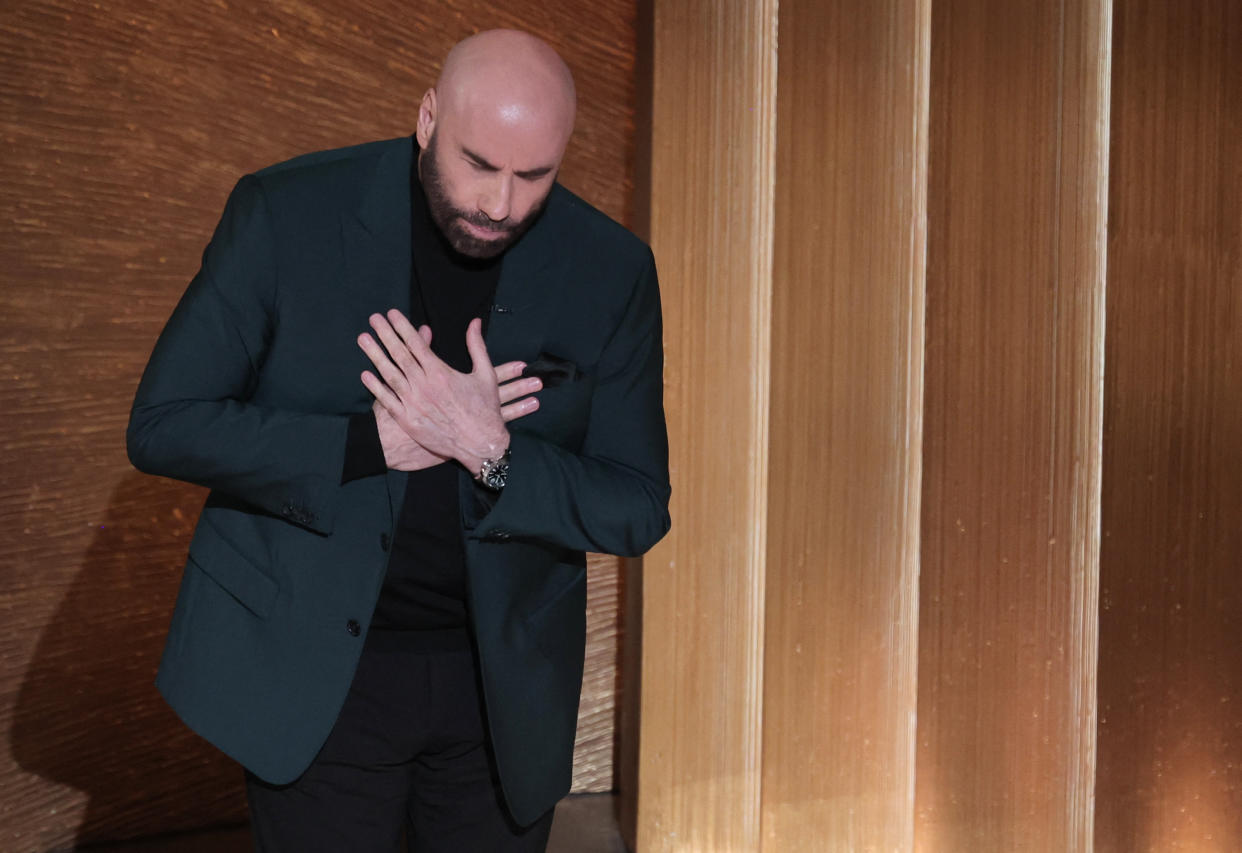 Actor John Travolta speaks at the start of the In Memoriam segment of the Oscars show at the 95th Academy Awards in Hollywood, Los Angeles, California, U.S., March 12, 2023. REUTERS/Carlos Barria