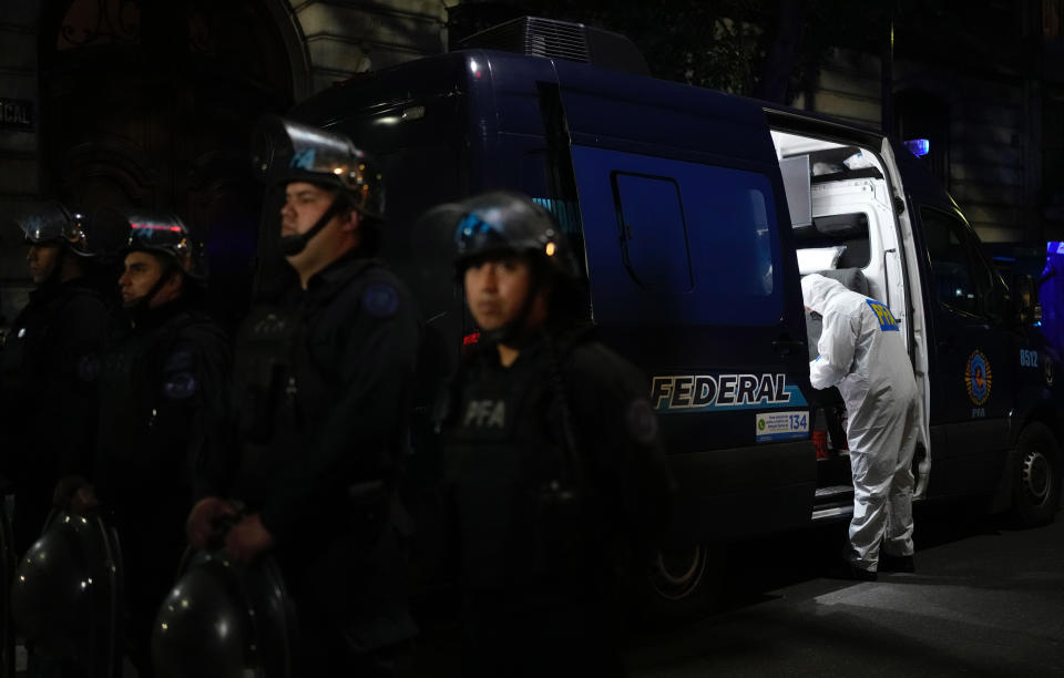 A police investigator works in his van at the scene where a man pointed a gun at Argentina's Vice President Cristina Fernandez during an event in front of her home in the Recoleta neighborhood of Buenos Aires, Argentina, Thursday, Sept. 1, 2022. (AP Photo/Natacha Pisarenko)