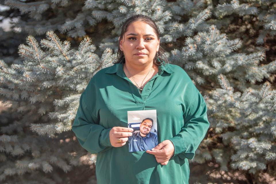 Samantha Gaona holds a photo of her brother Marcos Colunga-Gaona who was the victim of a June 2023 fatal shooting.