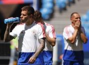 Soccer Football - World Cup - Russia Training - Samara Arena, Samara, Russia - June 24, 2018. Fyodor Smolov and Sergei Ignashevich attend a training session. REUTERS/David Gray