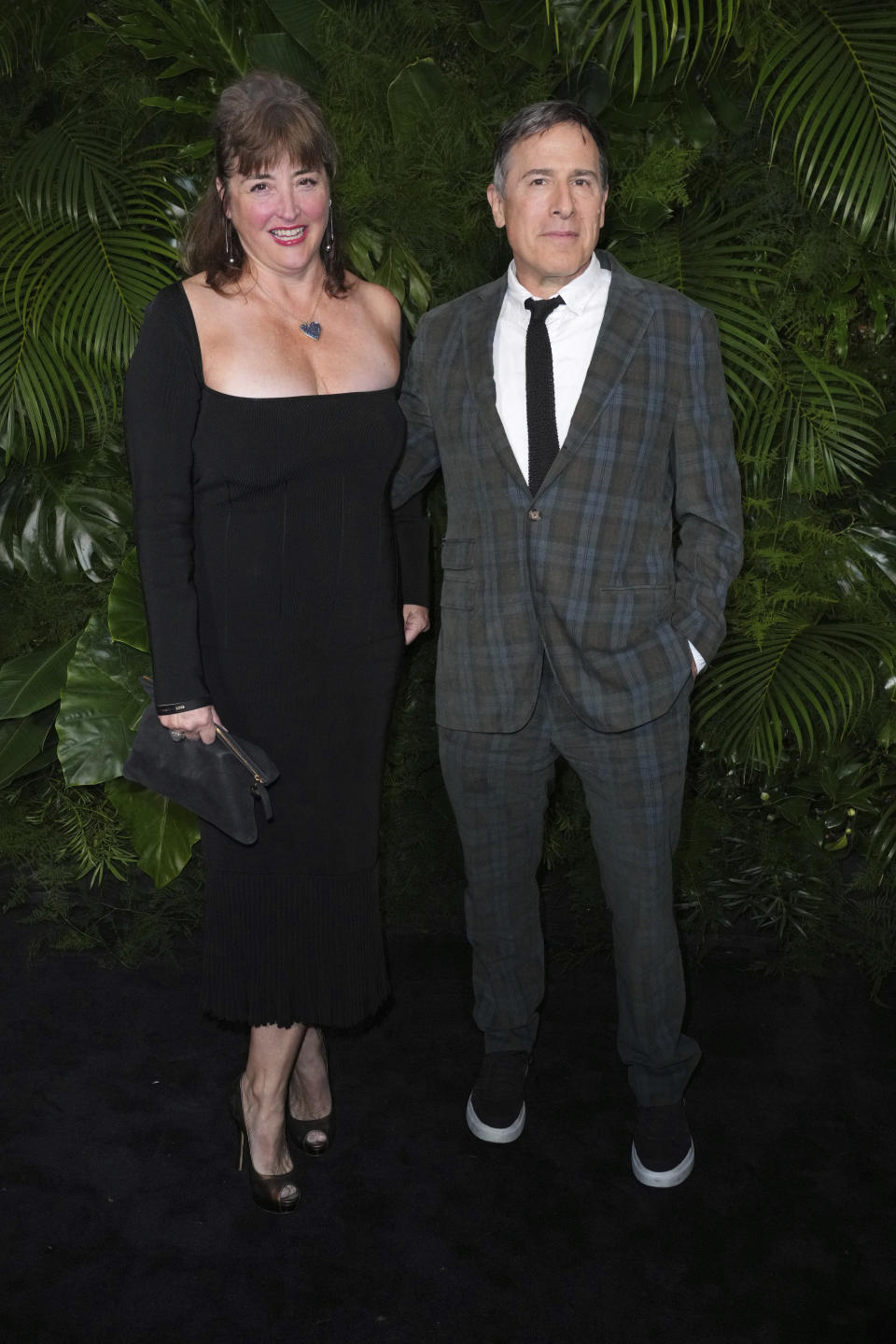 David O. Russell, left, and Holly Davis arrive at 14th annual Pre-Oscar Awards Dinner on Saturday, March 11, 2023, at the Beverly Hills Hotel in Beverly Hills, Calif. (Photo by Jordan Strauss/Invision/AP)