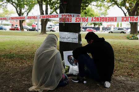 People visit at a memorial site for victims of Friday's shooting, in front of the Masjid Al Noor mosque in Christchurch, New Zealand March 18, 2019. REUTERS/Jorge Silva
