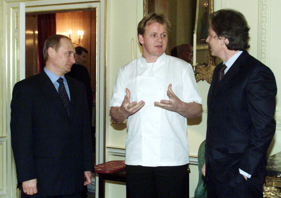 Britain's Prime Minister Tony Blair, right, and Russian President-elect Vladimir Putin, left, listen to British chef Gordon Ramsay, who cooked lunch, at 10 Downing Street, in London.   (Photo by PA Images via Getty Images)