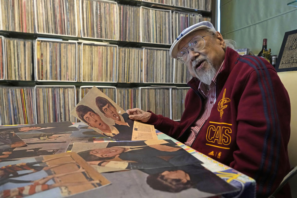 FILE - Ray Cordeiro, Hong Kong's oldest DJ shows the copies of his Beatles' autographs as the originals are kept with the lawyer, at his home in Hong Kong, Thursday, May 27, 2021. Cordeiro considers himself the luckiest radio DJ in the world. Cordeiro, who interviewed music acts including the Beatles during a six-decade career on Hong Kong radio that earned him the title of the world's longest-working disc jockey, died Friday, Jan. 13, 2023, his former employer announced. He was 98. (AP Photo/Kin Cheung, File)