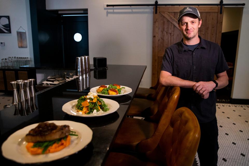 Gannon Hamilton, the executive chef at The Public Bistro, can be seen next to a few of the offered dishes at the restaurant in the Cooper-Young neighborhood in Memphis, Tenn., on Thursday, October 12, 2023.