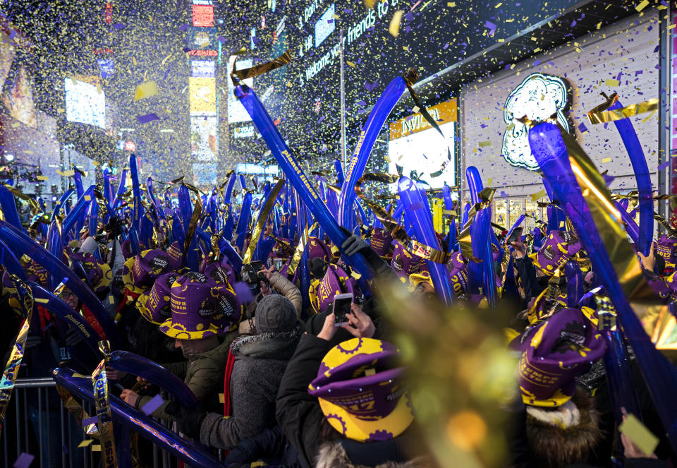 FILE - In this Dec. 31, 2016 file photo, confetti falls during one of the hourly countdowns as revelers take part in a New Year's Eve celebration in New York's Times Square. Year after year, people watching New York City's New Year's Eve celebration are told by city dignitaries and TV personalities that they are watching a million people gathered in Times Square. The AP asks experts whether it is actually possible to fit that many people into the viewing areas. (AP Photo/Craig Ruttle, File)