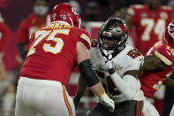 FILE - In this Sunday, Feb. 7, 2021 file photo, Tampa Bay Buccaneers outside linebacker Shaquil Barrett (58) moves in to block Kansas City Chiefs offensive tackle Mike Remmers (75) during the second half of the NFL Super Bowl 55 football game in Tampa, Fla. Applying franchise and even transition tags to players can have major ramifications on a team's present and future. That was never more of a consideration than this year, with the salary cap decreasing by, for now, $18 million. That's the first time the cap has gone down, which is due to lost revenues caused by the COVID-19 pandemic.(AP Photo/Steve Luciano, File)