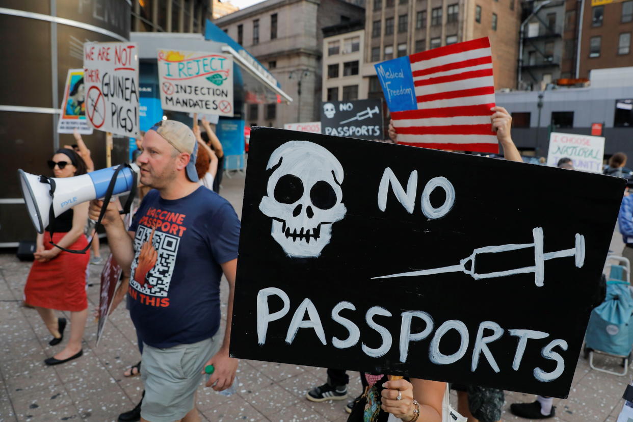 Anti-vaccine protesters gather outside Madison Square Garden ahead of a Foo Fighters' show, which requires proof of vaccination to enter, in New York City, U.S., June 20, 2021. (Andrew Kelly/Reuters)