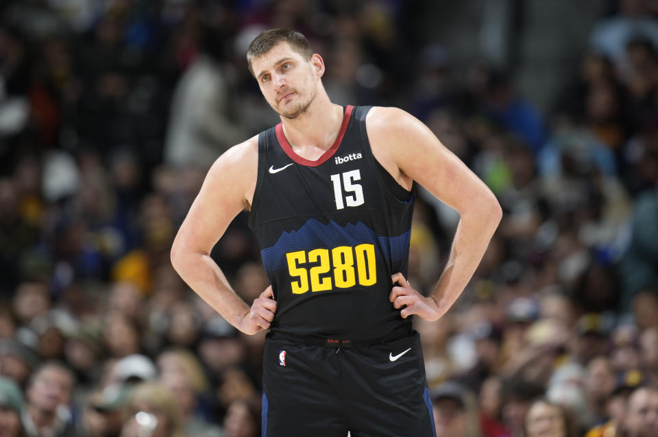 Denver Nuggets center Nikola Jokic waits for play to resume against the Detroit Pistons in the first half of an NBA basketball game Sunday, Jan. 7, 2024, in Denver. (AP Photo/David Zalubowski)