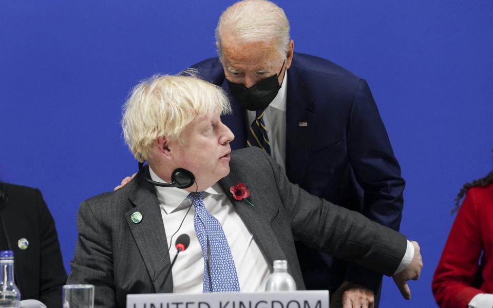 Boris Johnson pictured with President Joe Biden at today's Cop26 opening session - Kevin Lamarque/Pool/AFP via Getty