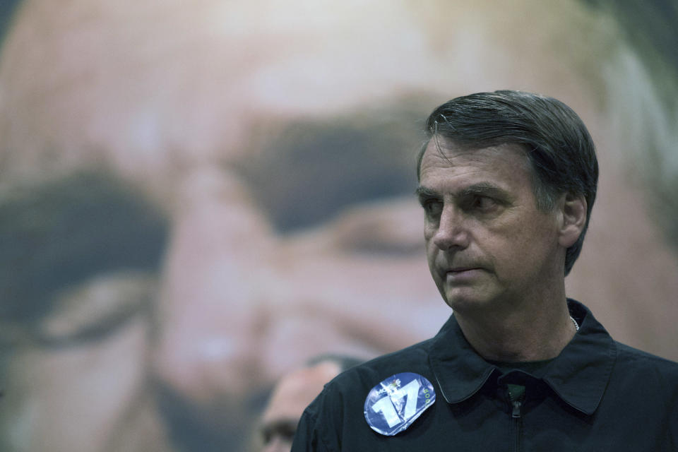 Presidential candidate Jair Bolsonaro, of the right wing Social Liberal Party arrives for a press conference in Rio de Janeiro, Brazil, Thursday, Oct. 11, 2018. Bolsonaro will face Workers Party presidential candidate Fernando Haddad in a presidential runoff on Oct. 28. (AP Photo/Leo Correa)