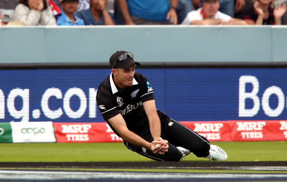 New Zealand's Tim Southee takes the wicket of Jos Buttler (not pictured) during the ICC World Cup Final at Lord's, London.