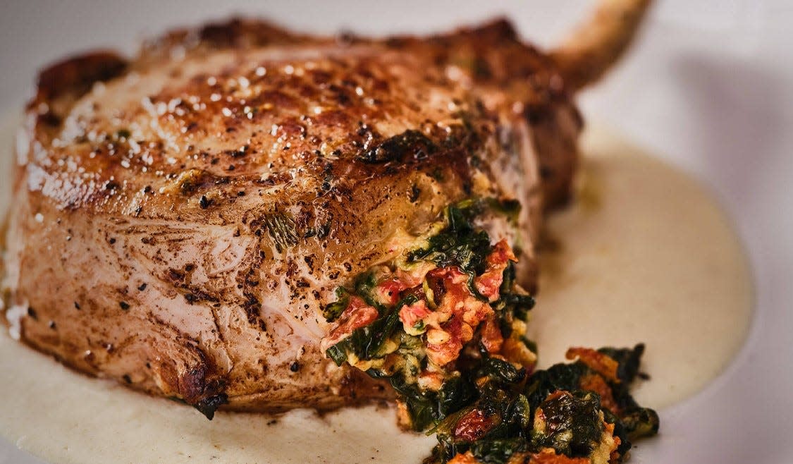 Sundried tomato and spinach-stuffed pork chop at Fleming's is part of the Easter dinner.