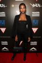 <p>Oh, hello, beauitful! Jasmine Tookes went the monochrome route in a strapless black top, pants, over-the-knee boots, and a jacket slung over her shoulders. (Photo: Getty Images)</p>