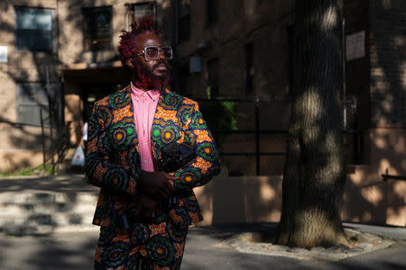 Josiah Esowe, a photographer based in New York, poses for a picture in the Brooklyn borough of New York, U.S., August 25, 2018. REUTERS/Caitlin Ochs
