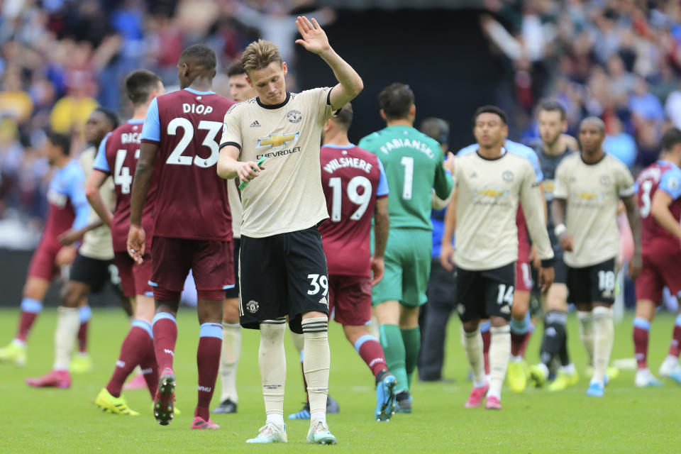Manchester United's Scott McTominay salutes supporters at at the end of the English Premier League soccer match between West Ham and Manchester United at London stadium in London, Sunday, Sept. 22, 2019. West Ham beat Manchester United 2-0. (AP Photo/Leila Coker)