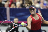 United States' Sofia Kenin returns a shot against Latvia's Jelena Ostapenko during a Fed Cup qualifying tennis match Saturday, Feb. 8, 2020, in Everett, Wash. (AP Photo/Elaine Thompson)