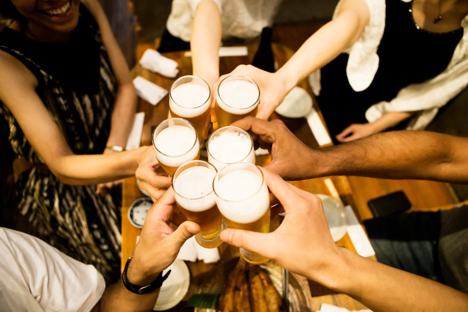 a group of people making a toast