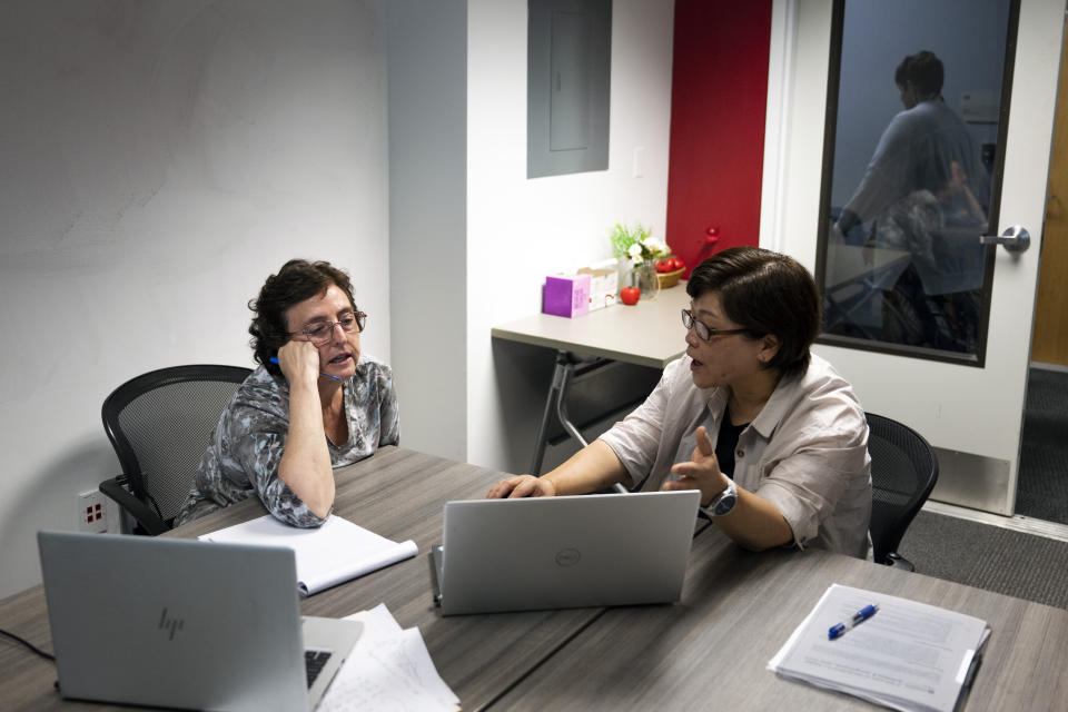 Robin Kolodny, left, a political science professor, works with Eunsook Ha Rhee, an associate professor of instruction, during a faculty teaching circle on artificial intelligence on Wednesday, Aug. 9, 2023, at Temple University in Philadelphia. Educators say they want to embrace the technology’s potential to teach and learn in new ways, but when it comes to assessing students, they see a need to “ChatGPT-proof” test questions and assignments. (AP Photo/Joe Lamberti)