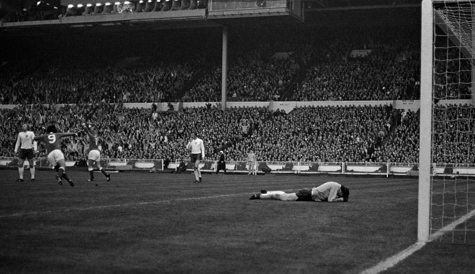 FILE - In this April 29, 1972 file photo England goalkeeper Gordon Banks, lies on the turf after being beaten for West Germany's first goal, scored by Uli Hoeness in the European Nations Soccer Cup quarter final, first leg at Wembley Stadium in London. (AP Photo/Paul Harris, File)
