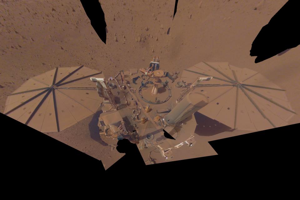 This image provided by NASA shows the InSight Mars lander in a selfie photo composite on April 24, 2022, the 1,211th Martian day, or sol, of the mission. The lander's solar panels have become covered with dust since the lander touched down on Mars in November 2018, which has led to a gradual decline in its power level. On Thursday, Oct. 27, 2022, NASA announced two of their spacecraft, one on the surface and the other in orbit,. have recorded the biggest meteor strikes and impact craters yet. (NASA/JPL-Caltech via AP)