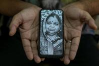 The Wider Image: Indians share the stories of loved ones they lost to the pandemic