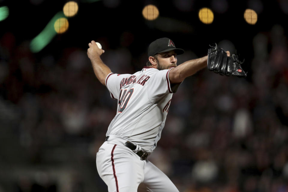 Arizona Diamondbacks' Madison Bumgarner throws against San Francisco Giants during the first inning of a baseball game in San Francisco, Thursday, Sept. 30, 2021. (AP Photo/Jed Jacobsohn)