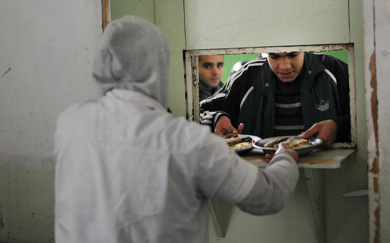 An inmate receives his lunch in the main building of Boychinovtsi Correctional Home, in north-west Bulgaria
